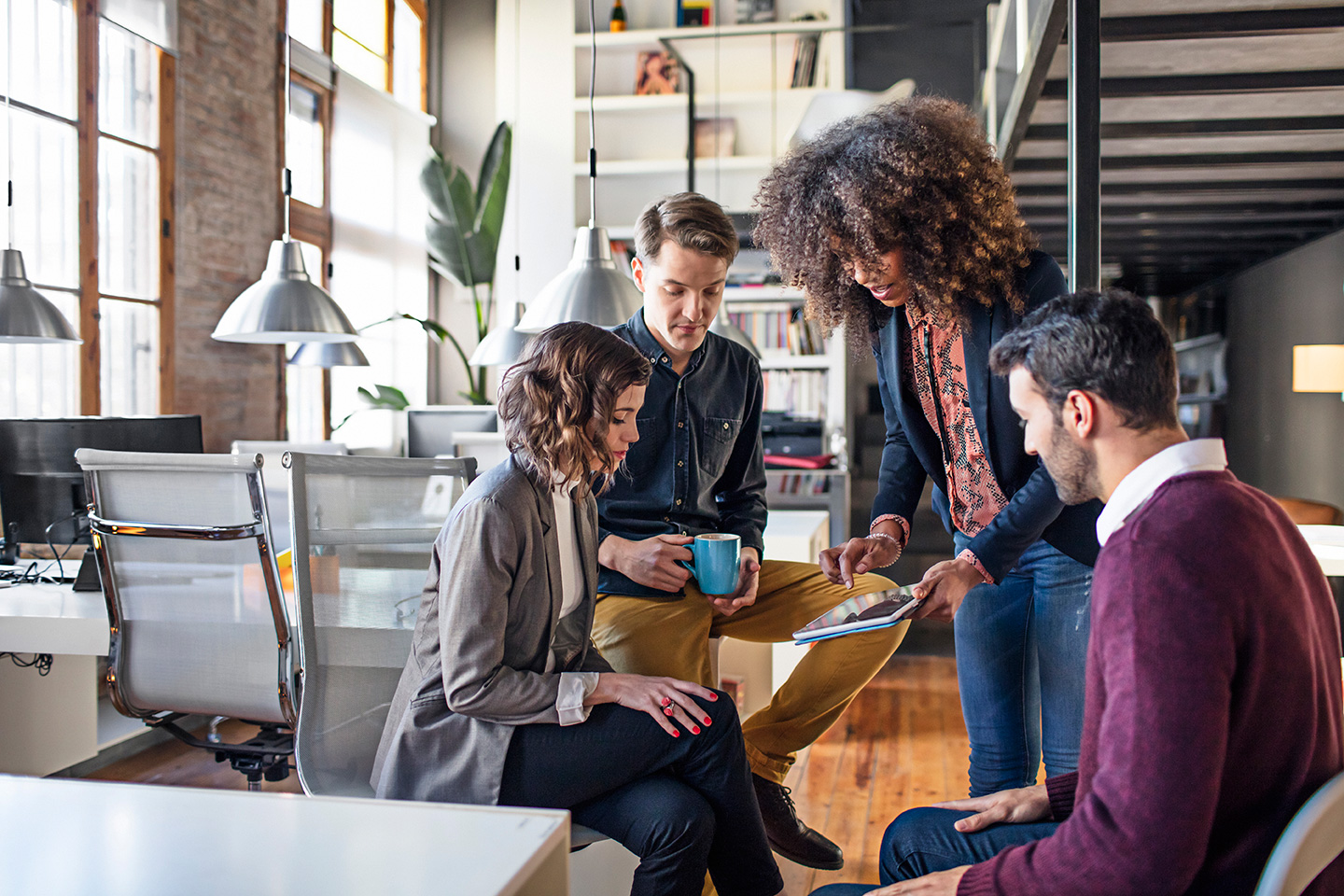 Team of diverse professionals collaborating in a modern office space.